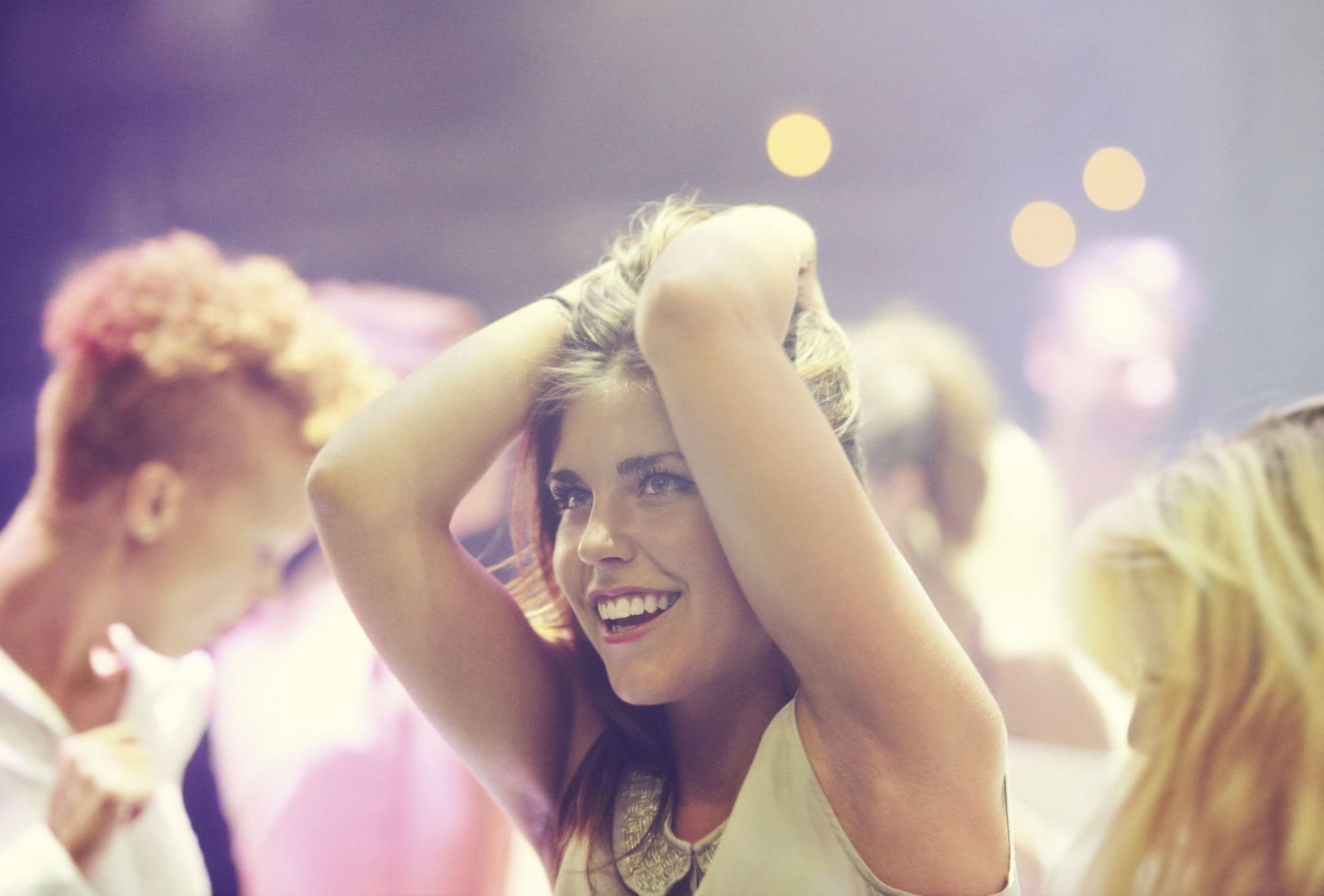 Guest dancing and smiling on the dance floor